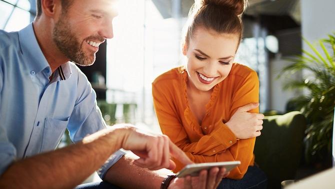 Two people happy in a business meeting